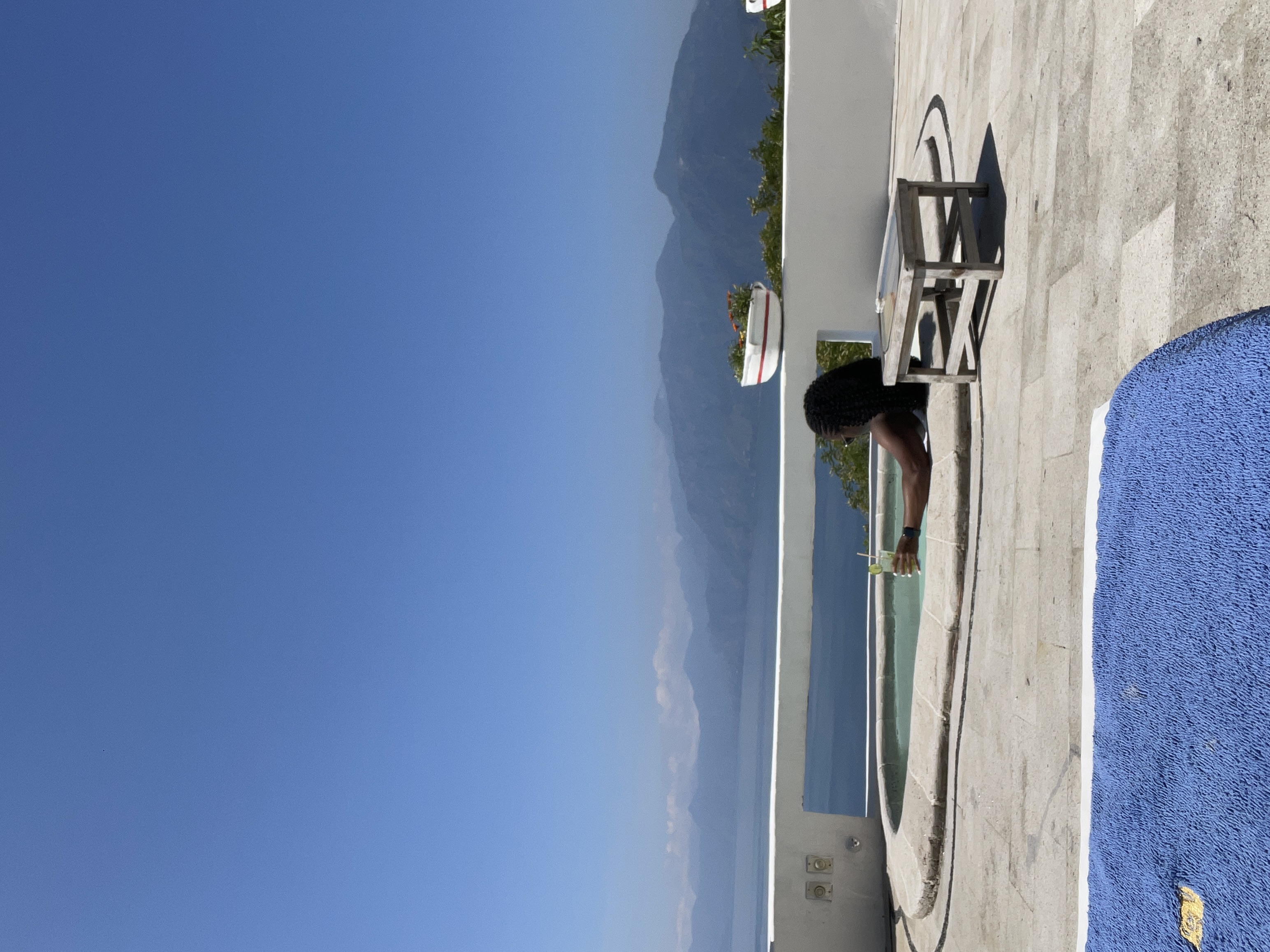 Infinity pool with breathtaking mountain and lake views