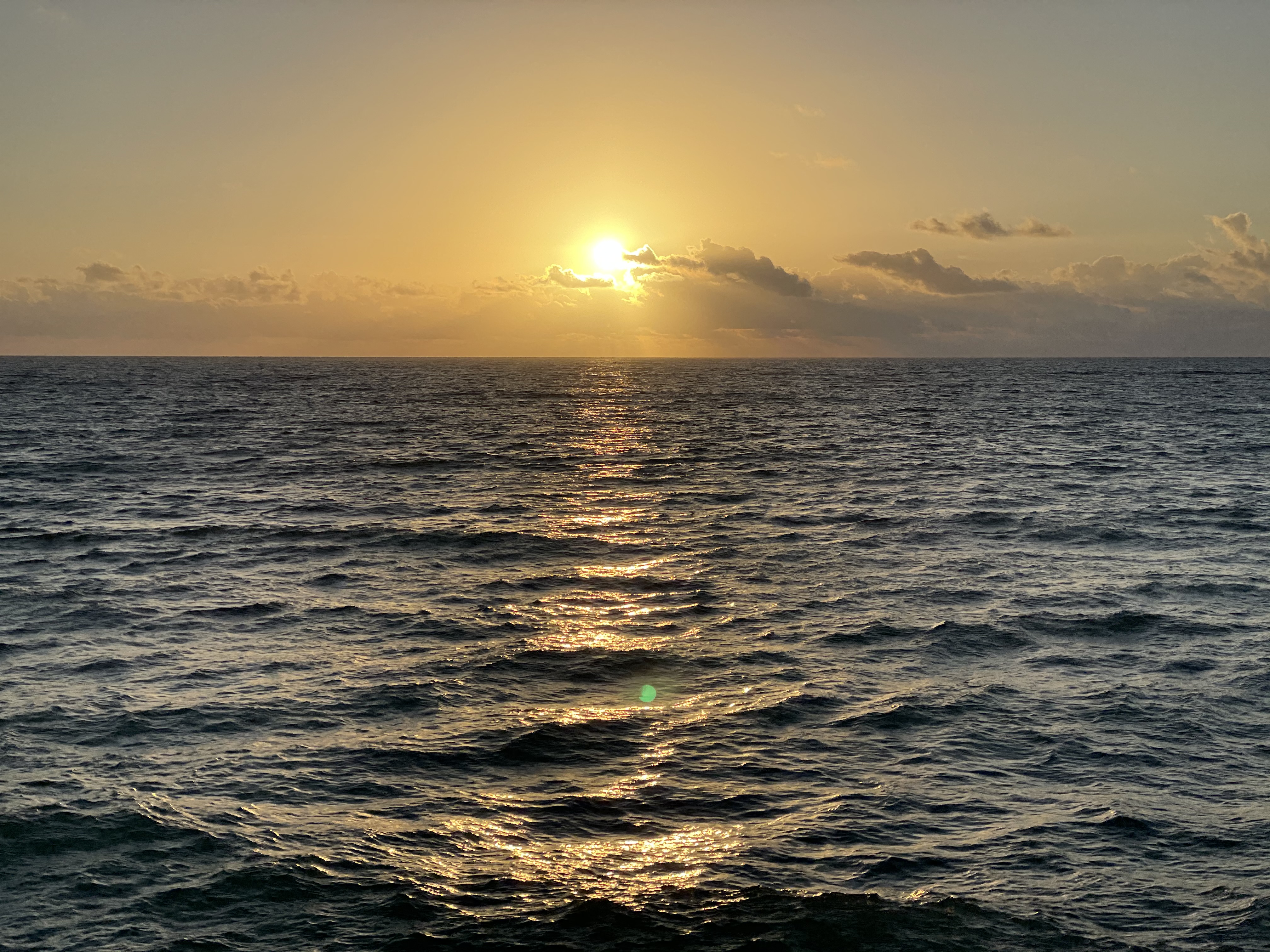 Golden sunset over an endless open ocean